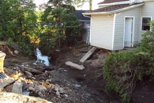 this house lost its oil tank and a back shed addition.